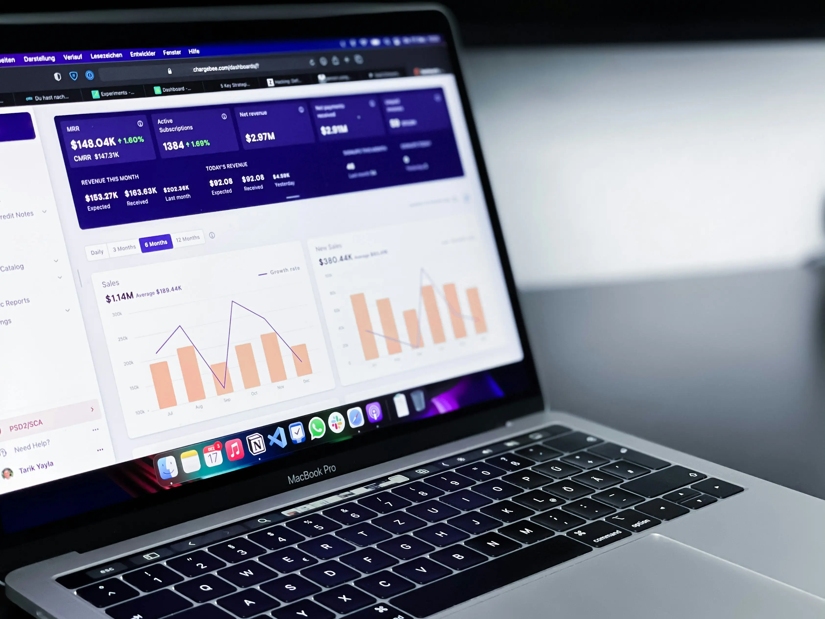 Laptop displaying financial data graphs